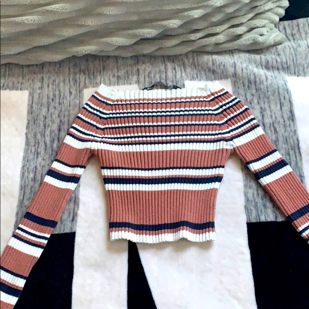 This is an off the shoulder cropped shirt
